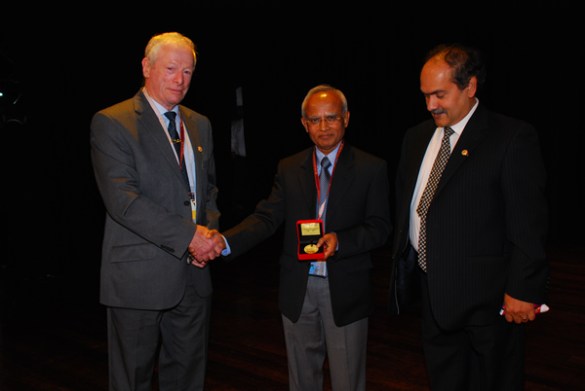 Prof Rahman (centre) receiving the William Johnson International Gold Medal. He is flanked by Prof Frank Travies (left), past president of AMPT and Prof Sarwar Hashmee (right), current president of AMPT.